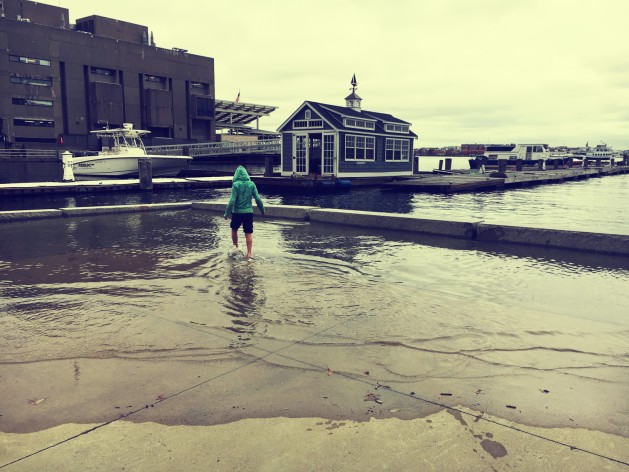 Flooding at Long Wharf during the King Tides in mid-November gave Bostonians a preview of climate change. Photo by Gwendolyn Schanker; filter by BeFunky.